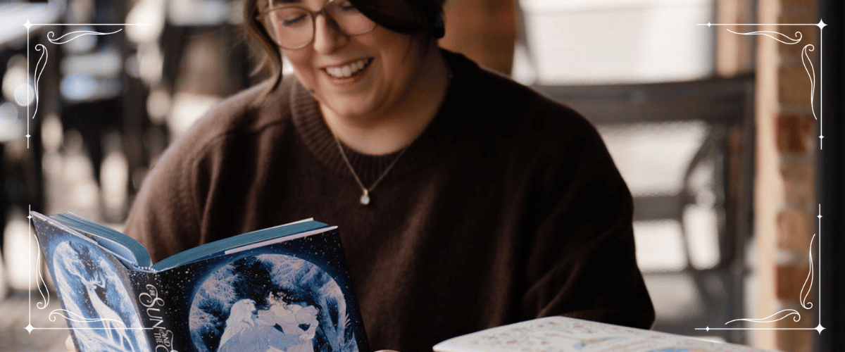woman reading outside a coffee shop